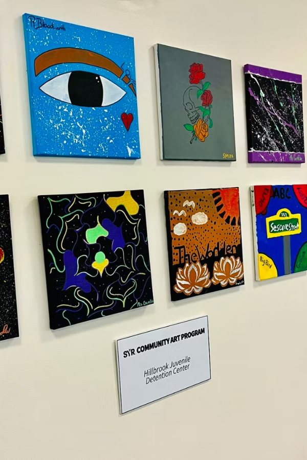 Student paintings from Hillbrook Juvenile Detention Center on display at the Syracuse airport